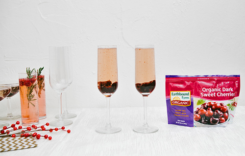 Frozen sweet cherries + Prosecco in a tall flute